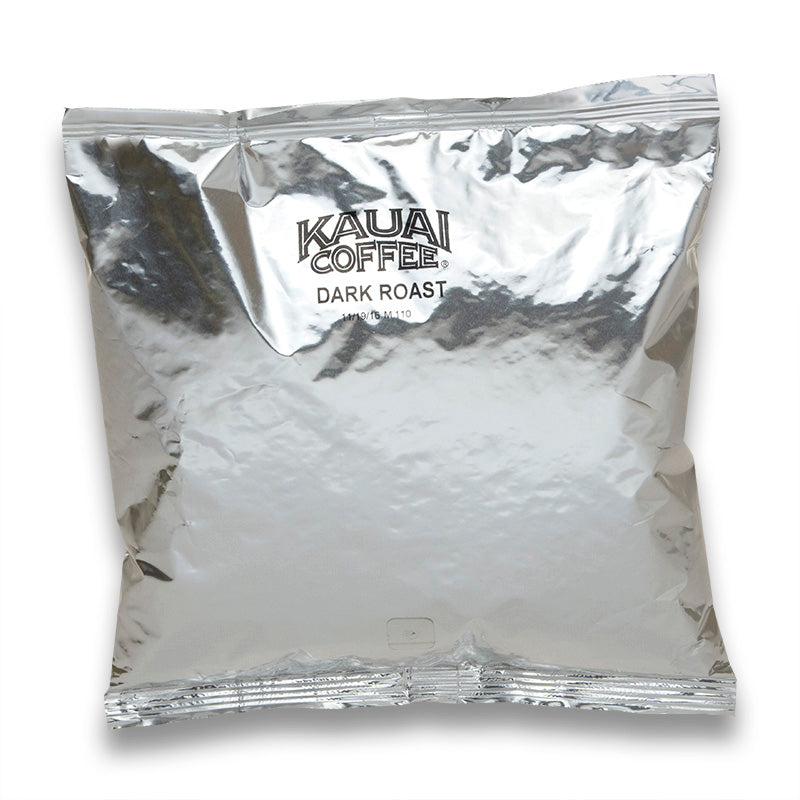 Kauai Coffee Dark Roast in a silver packaged bag, with visibly crumpled and reflective surface.
